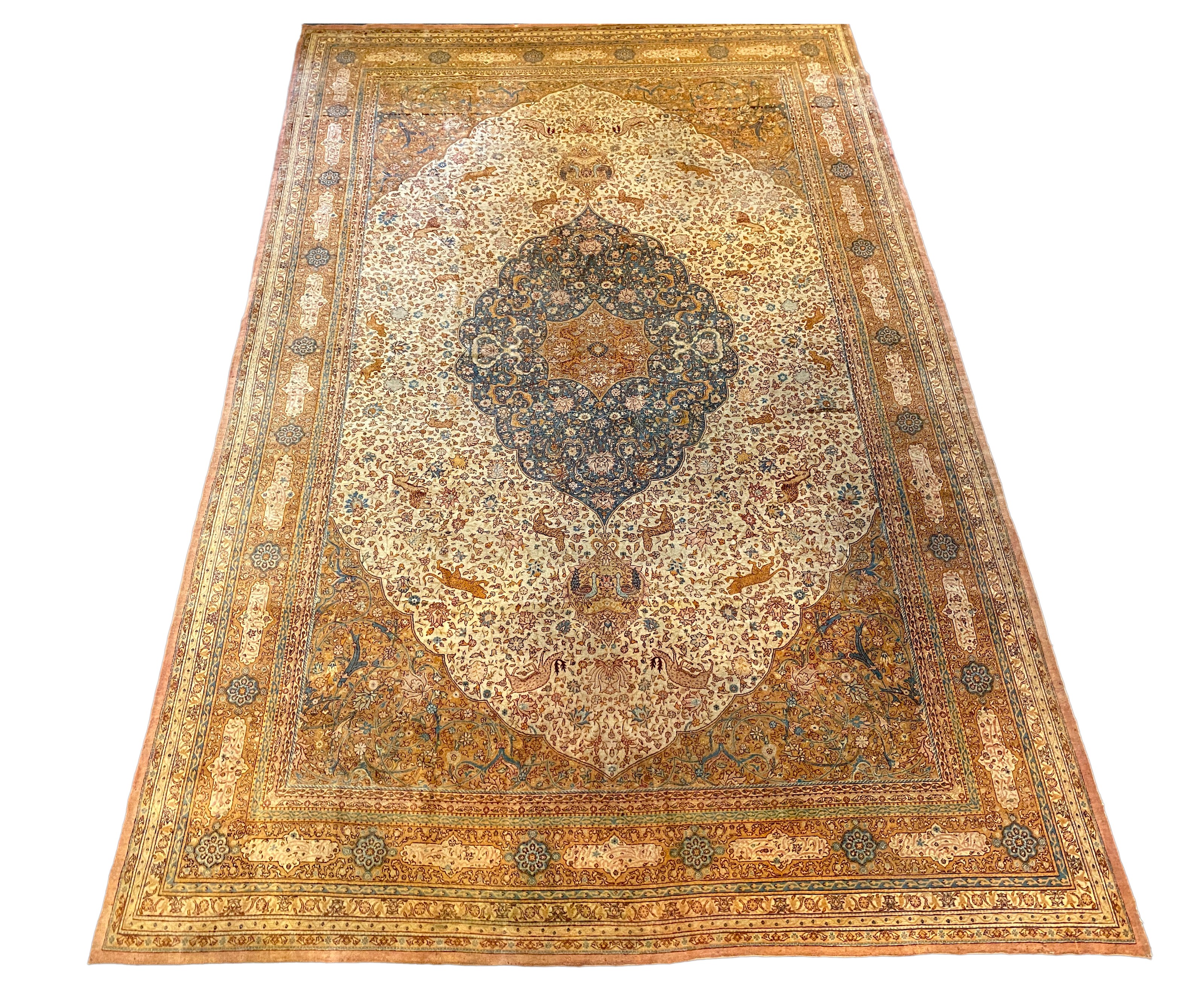 An early 20th century Tabriz ivory ground carpet, 528 x 348cm